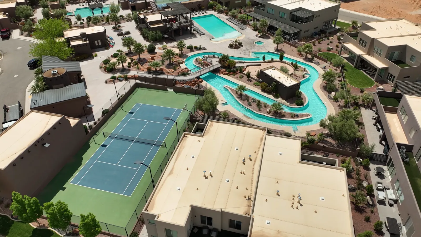 A resort community from the air, pools and courts in frame
